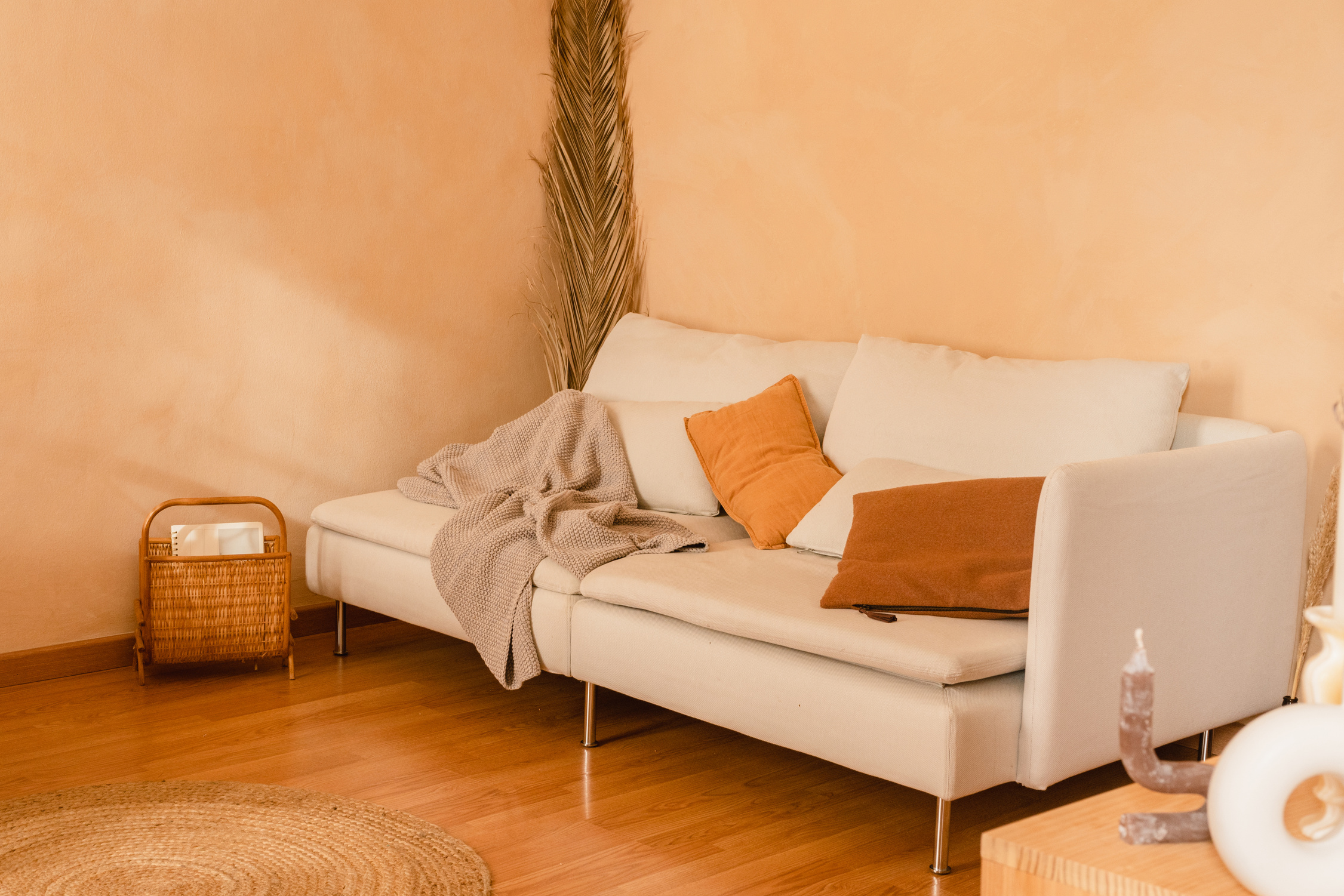 White Couch with Pillows and Plaid